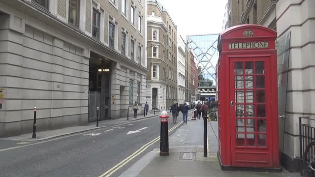 a typical London’s street and the classical red telephone booth