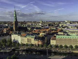 Fototapeta na wymiar view over the rooftops of Copenhagen Denmark with a blue sunny sky
