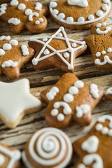 Gingerbread cookies arranged on wooden plank