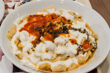Turkish Manti Manlama with yogurt and fried butter sauce