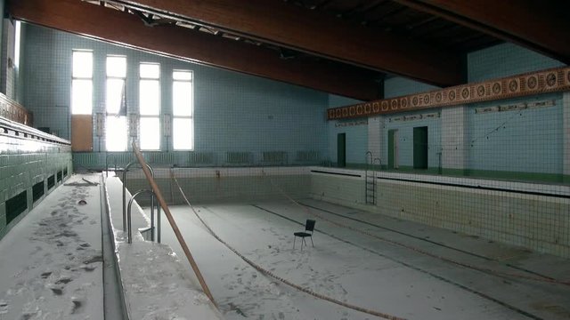 Swimming pool in building of Palace of Culture and Sports in Pyramiden Arctic. Russian neglected township on Spitsbergen . Canned place times of Soviet Union. Time stood still of North Pole.