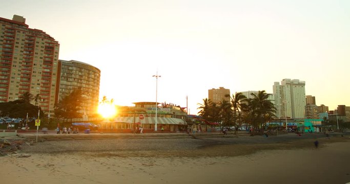 Timelapse of the city and local people at sunset in Durban, South Africa.