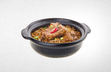 Claypot pork rice or pork rice on a background.