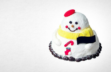 cake or christmas snowmen cake on a background.