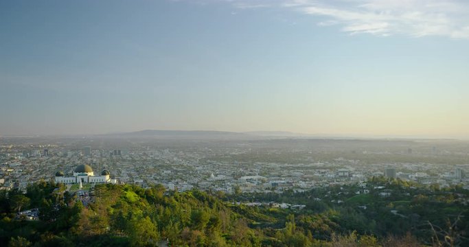 The Griffith Observatory and LA skyline in the distance in Los Angeles, California.