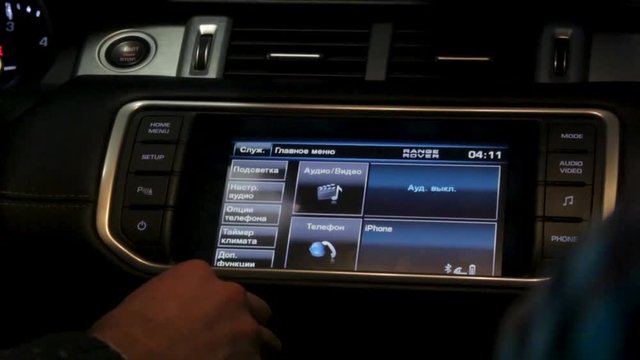 Man driving a car, driving. Footage. Listening to music adding to the maximum sound. Vehicle management. Car audio system close up