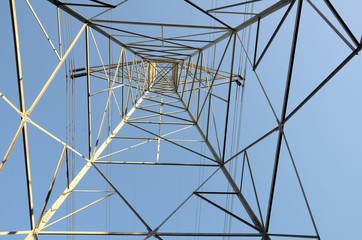 An electrical tower from below conveys a sense of height and power