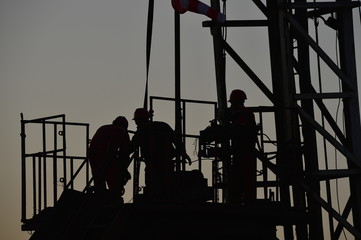 field oil workers at work