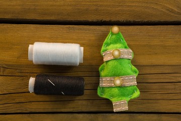 Overhead view of thread spools by Christmas decoration