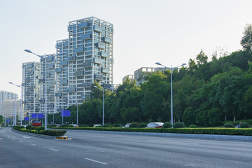 Fototapeta na wymiar Road with modern building background during rush hour