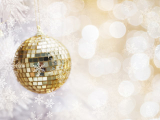 Abstract blurred of golden glitter balls on white fir pine tree and bokeh with copy space.