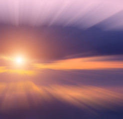 Sunset from storm clouds over the sea.