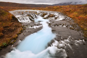 Autumn in Bruarfoss, a blue waterfall in South Iceland