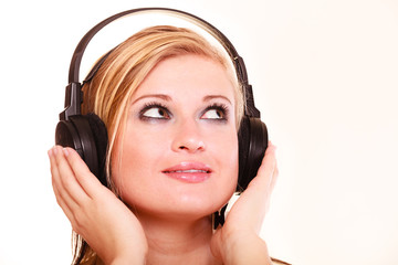 Portrait woman listening to music on headphones