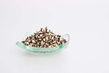 Chocolate chip morsels spread on a background.