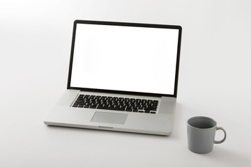 notebook with stationary on the white background.