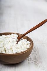 Cottage cheese in a wooden bowl