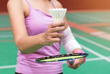 closeup elderly old woman hand of badminton player, health care concept
