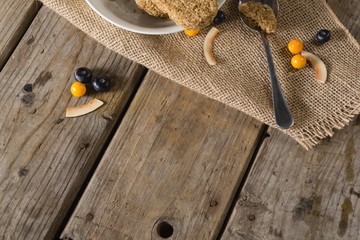 Granola bar and berry fruit on wooden table