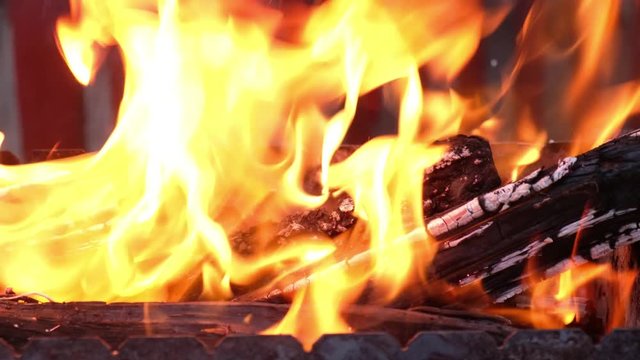 Open fire in iron barbecue stove