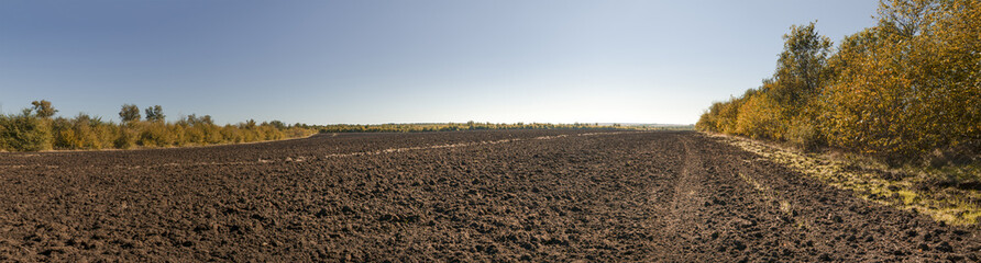 Russian plowed field of chernozem (black earth, humus). © sytilin