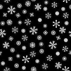 white snowflakes on black background