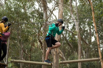 Man enjoying zip line adventure in park