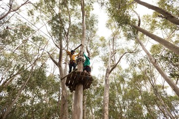 Fototapeta premium Friends ready to zip line in park