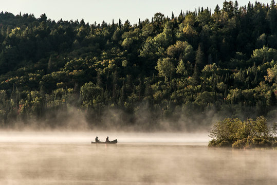 Canada Ontario Lake of two rivers Canoe Canoes foggy water sunrise fog golden hour on water in Algonquin National Park