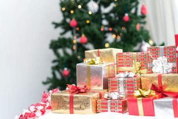 Christmas holiday concept. Many Gift box surprise luxury on bed and christmas tree background at home celebrate,