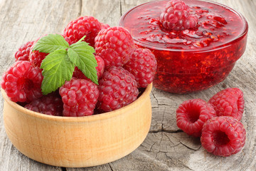 healthy food. raspberry with raspberry jam on old wooden background