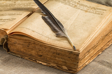 Opened retro  book on wooden table