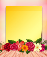 Yellow notepad and colorful flowers