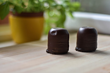 chocolate marsh-mallow on light wooden table