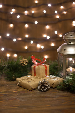 Burning lantern and christmas decoration on white background
