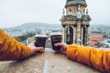two cups of coffe panormaic view to old european city