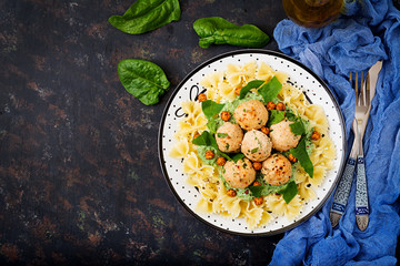 Farfalle pasta with meatballs and spinach  sauce with fried chickpeas. Proper nutrition. Sports nutrition. Dietary menu. Flat lay. Top view