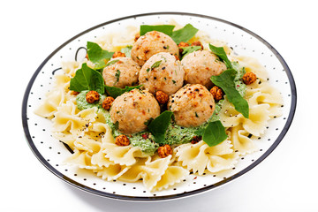Farfalle pasta with meatballs and spinach  sauce with fried chickpeas. Proper nutrition. Sports nutrition. Dietary menu.