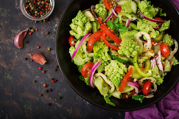 Vegan salad of fresh vegetables and cabbage romanesko. Dietary menu. Proper nutrition. Flat lay. Top view