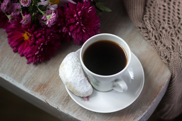 Autumn still life with coffee, homemade biscuits vanilla crescents, chrysanthemums and plaid.