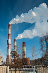 Industrial zone, smoke pipes, heat loss winter, environmental pollution
