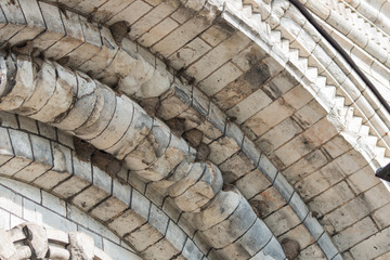 Nests of swallows under the vaults of a round stone roof