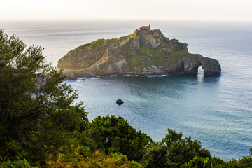 Sunset at San Juan de Gaztelugatxe, a famous peninsula in the coast of Bermeo, Basque Country, Spain