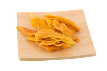 Dried mango fruit slices In a wooden tray isolated on white background