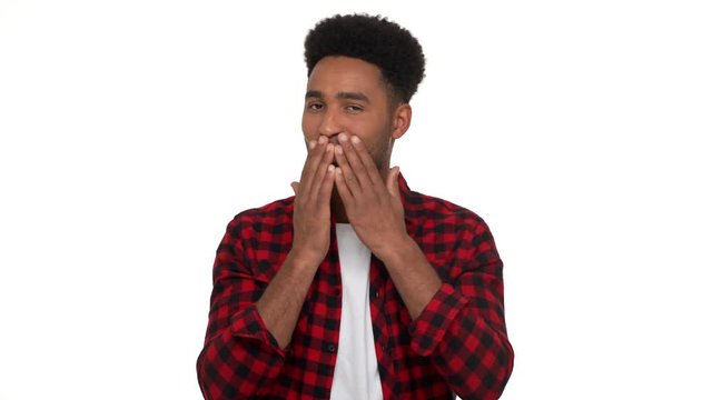 portrait of kind smiling man with african hairdo showing symbols of tree wise monkeys - see no evil, hear no evil, speak no evil poses isolated over white background. Concept of emotions