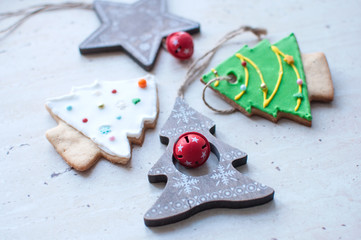 Diversity of Christmas toys - wooden toys and gingerbread cookies in the different shapes.