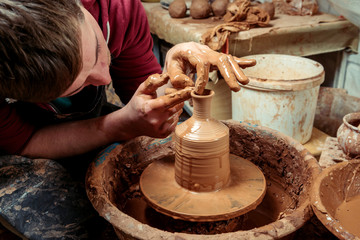Potter at work. Workshop.