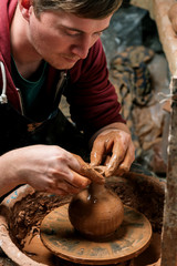 Potter at work. Workshop.