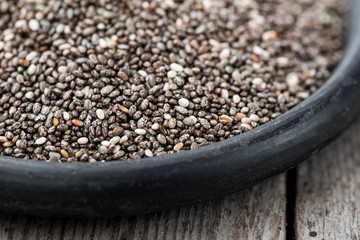Healthy Chia seeds in a spoon on the table close-up. Nutritious chia seeds