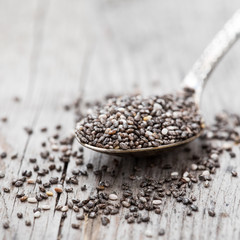 Healthy Chia seeds in a spoon on the table close-up. Nutritious chia seeds
